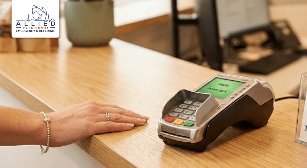 Card terminal on a reception desk at Allied Veterinary for paying the cost of emergency vet visit in Minnesota.